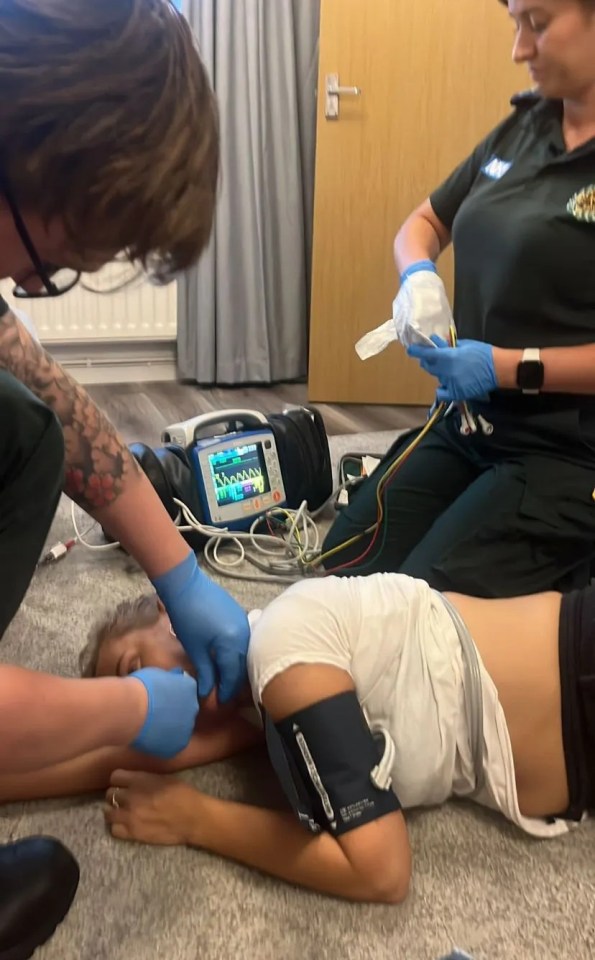 Paramedics attending to a patient.