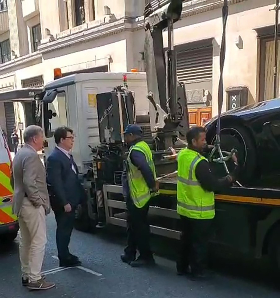Michael McIntyre's car being towed away.