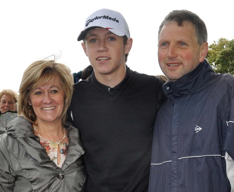Niall Horan with his parents.