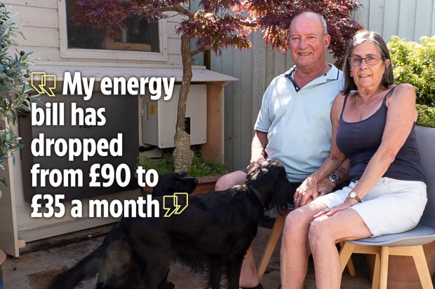 Couple sitting outside with their dog; quote: "My energy bill has dropped from £90 to £35 a month."
