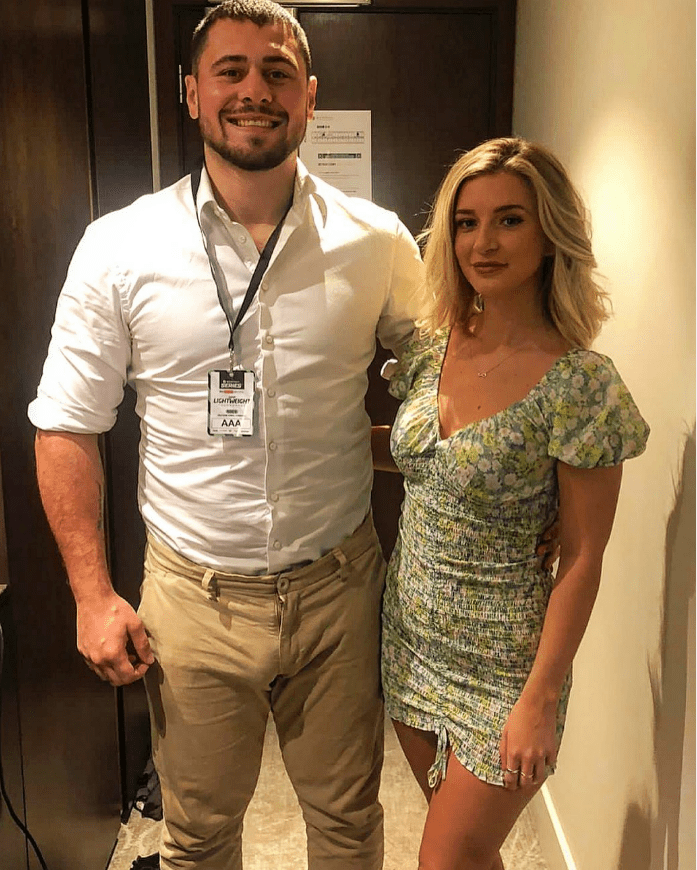 Photo of a man and woman standing together.