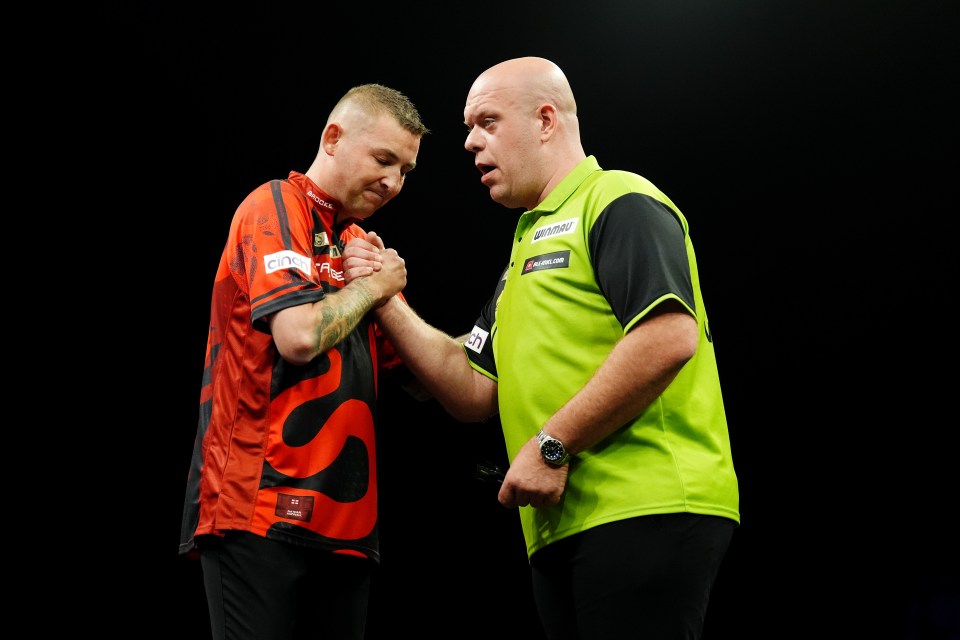 Nathan Aspinall wins his match and embraces Michael van Gerwen (right) on night fifteen of the BetMGM Premier League at P&J Live, Aberdeen. Picture date: Thursday May 15, 2025. PA Photo. See PA story DARTS Aberdeen. Photo credit should read: Andrew Milligan/PA Wire. RESTRICTIONS: Use subject to restrictions. Editorial use only, no commercial use without prior consent from rights holder.