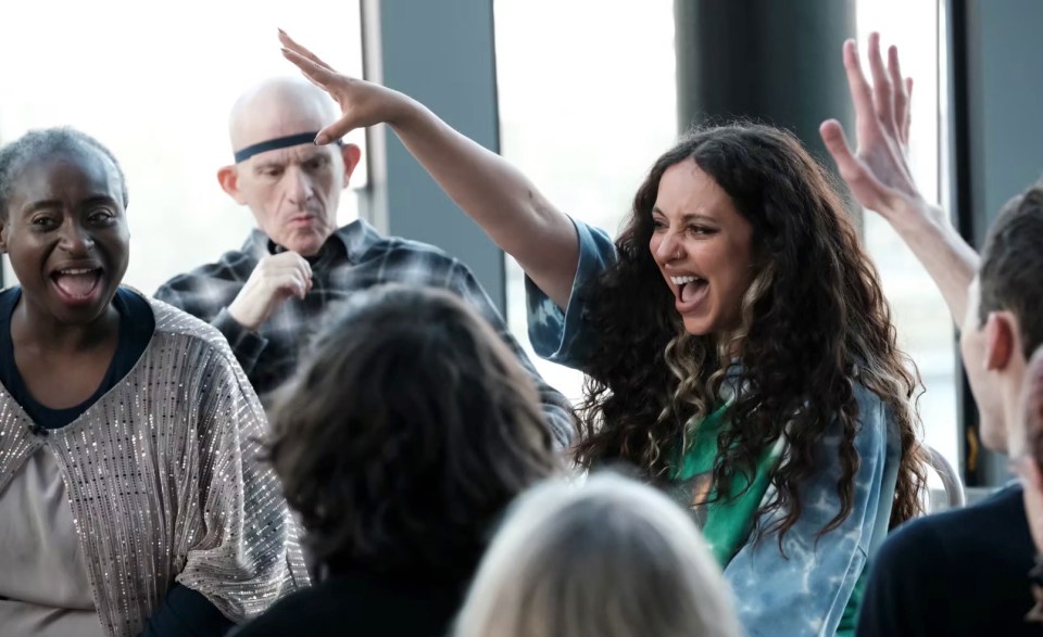 Jade Thirlwall playing a game with a group of people.
