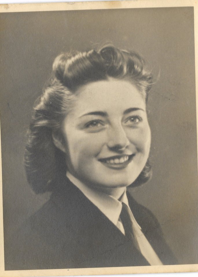 Black and white portrait of a smiling woman.
