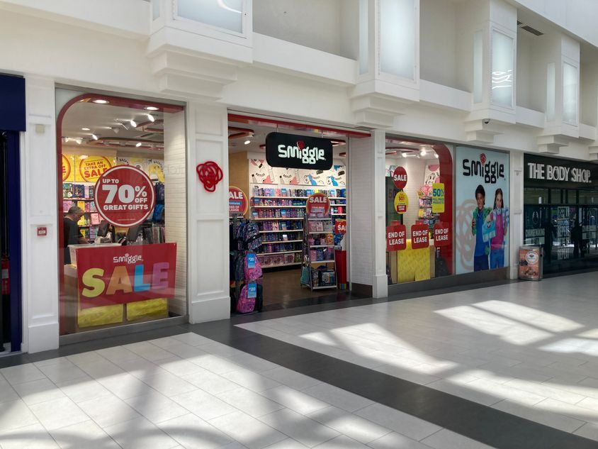 Smiggle store in a shopping mall with a sale.
