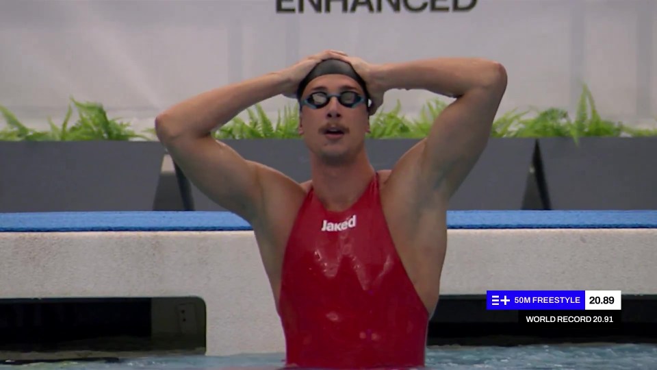 Swimmer in red swimsuit after a 50m freestyle race.
