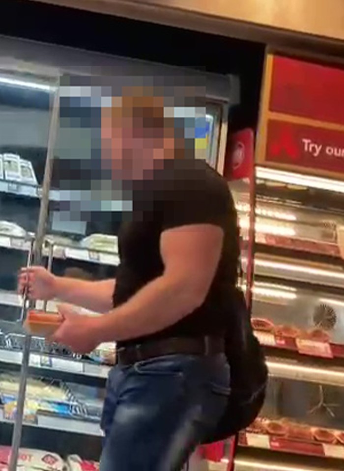 A man shopping in a convenience store.