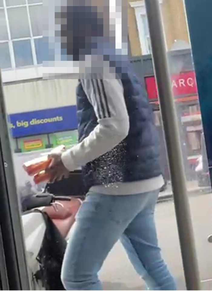 Person holding food items.