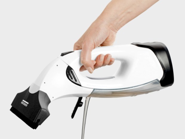 Hand holding a Karcher window vacuum.