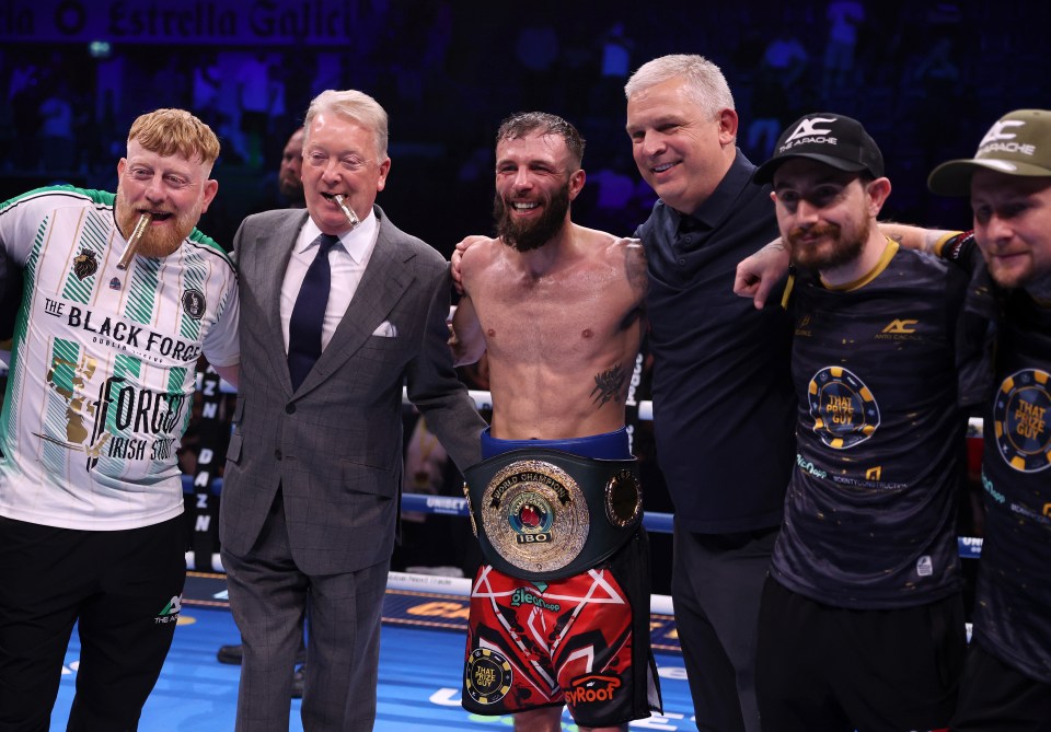 Anthony Cacace with his coaching staff and Frank Warren after winning the IBO World Super Featherweight title.