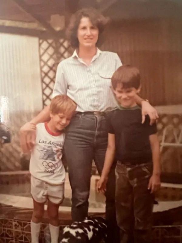Photo of a woman with her two sons.