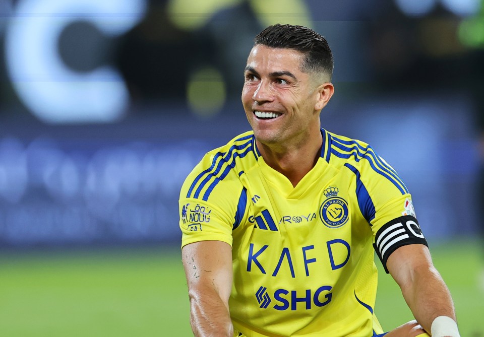Cristiano Ronaldo of Al Nassr smiling during a soccer match.