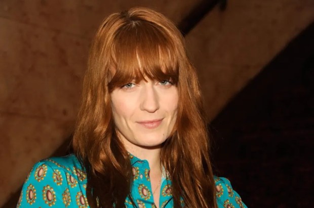 Florence Welch in a teal patterned dress.