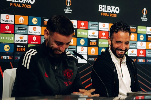 Ruben Amorim and Manchester United staff at a press conference.