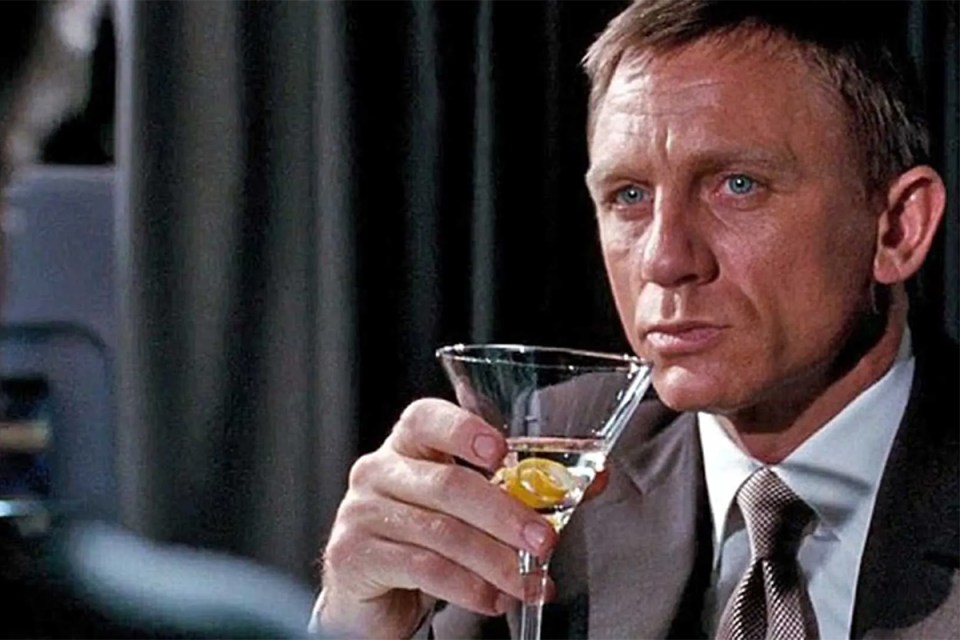 Daniel Craig as James Bond holding a martini.