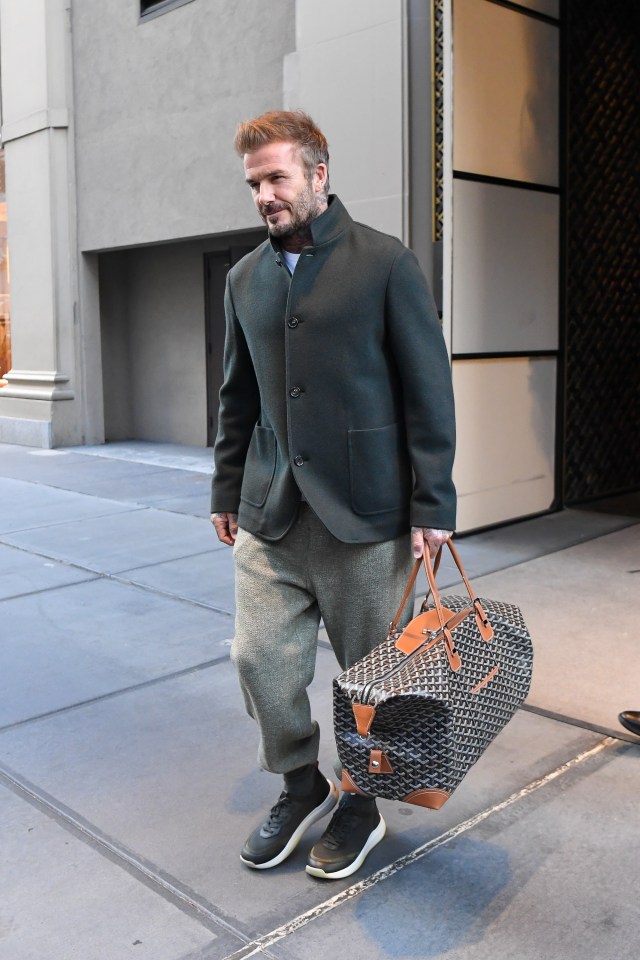 David Beckham walking in Manhattan carrying a Goyard bag.