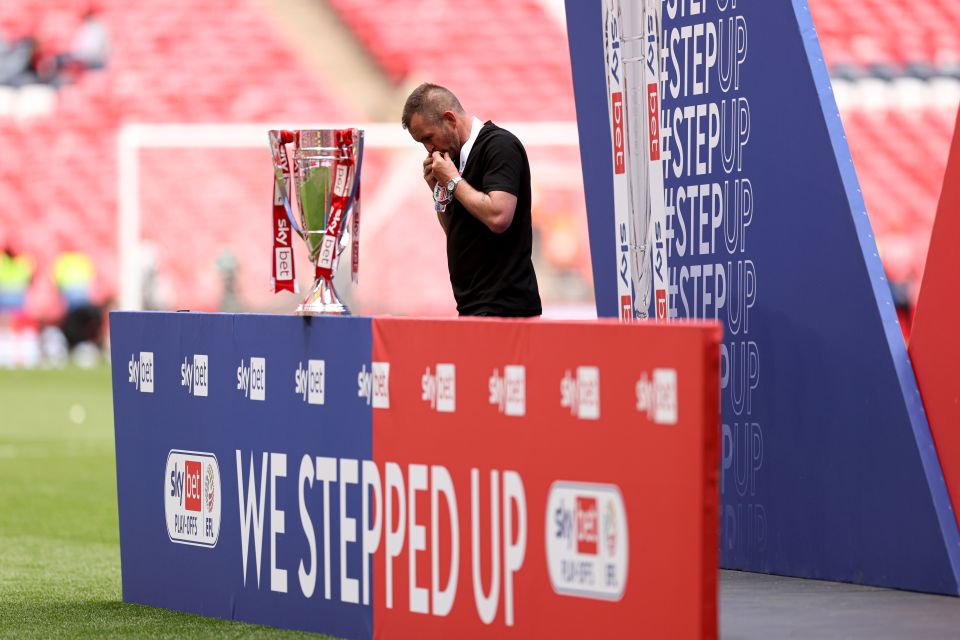 Charlton Athletic manager Nathan Jones with the Sky Bet League One Play-Off Final trophy.
