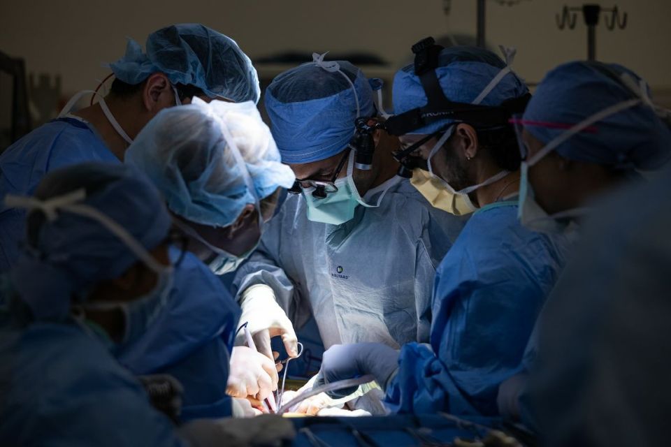 Surgeons performing a transplant operation.