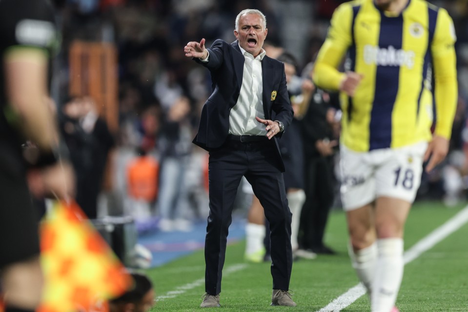 Jose Mourinho, Fenerbahce's head coach, instructing players during a soccer match.