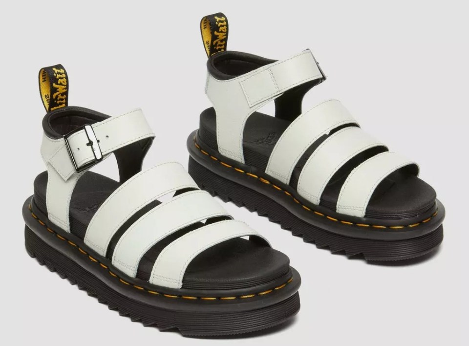 Pair of white Dr. Martens Blaire Athena leather sandals.
