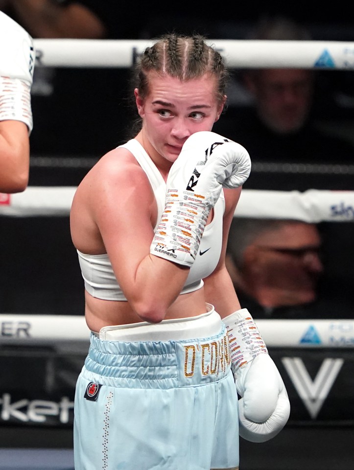Georgia O'Connor reacting after a welterweight boxing match.
