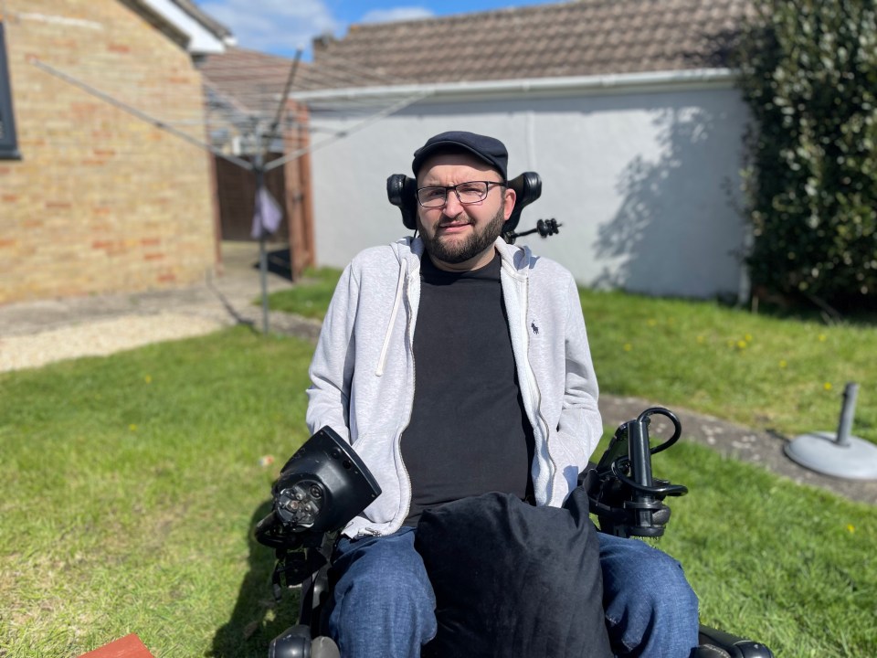 Man in wheelchair outdoors.