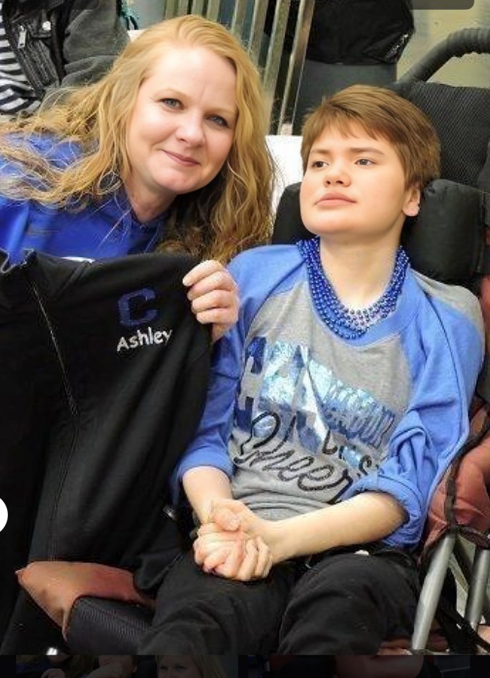 Woman holding hands with a disabled daughter.