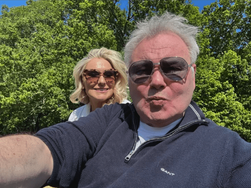 Selfie of a man and woman outdoors.