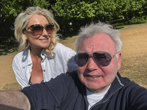 Selfie of a man and woman outdoors.