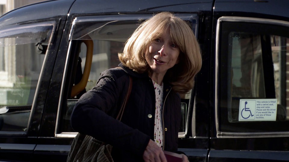Audrey Roberts getting into a taxi.