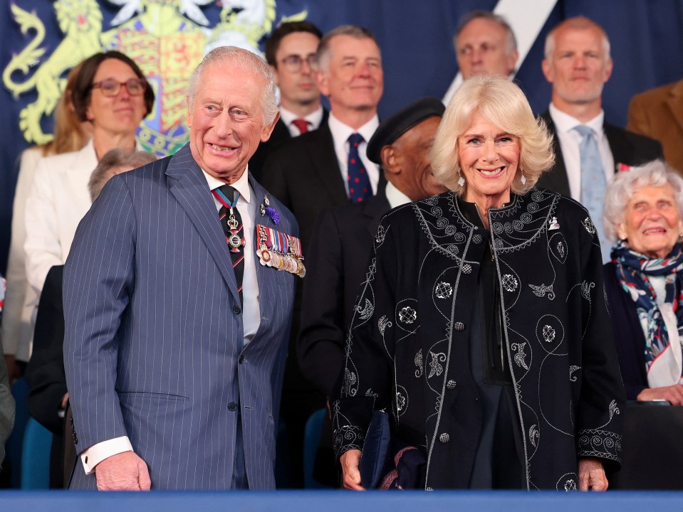 King Charles III and Queen Camilla at a concert.