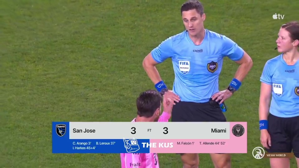 Lionel Messi arguing with a referee during a soccer game.