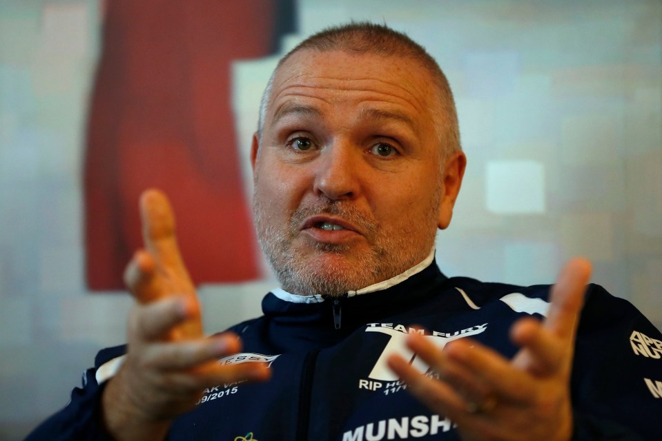 Peter Fury, boxing trainer, speaks to the media.
