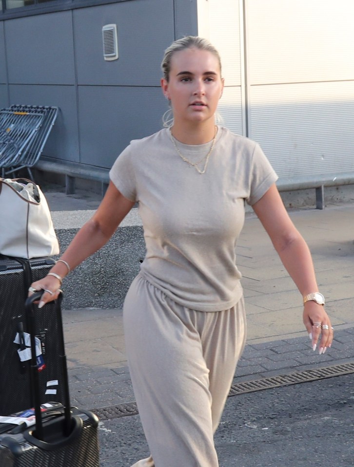 Molly Mae and Tommy Fury arriving at an airport.