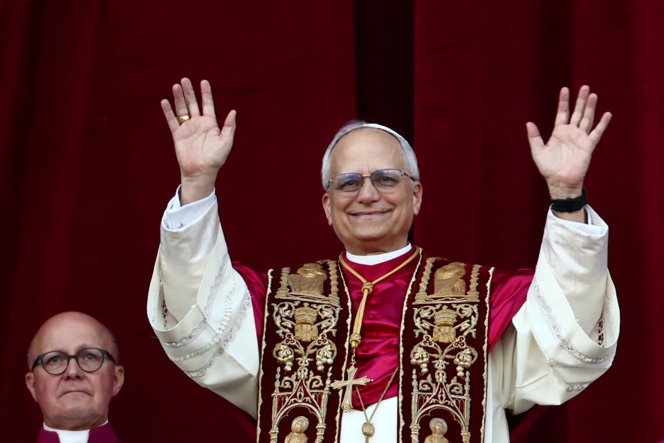 Newly elected Pope Leo XIV waving to the crowd.