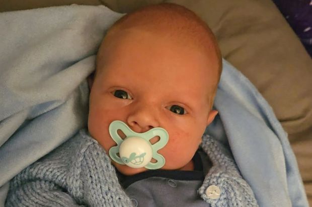 An image collage containing 1 images, Image 1 shows Baby Harley Wilkinson in a blue knitted cardigan