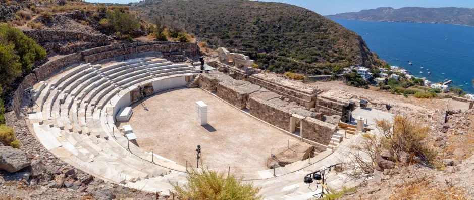 Panorama of an ancient Roman theater overlooking the sea.