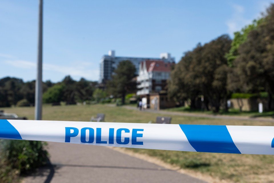 Police tape across a path.