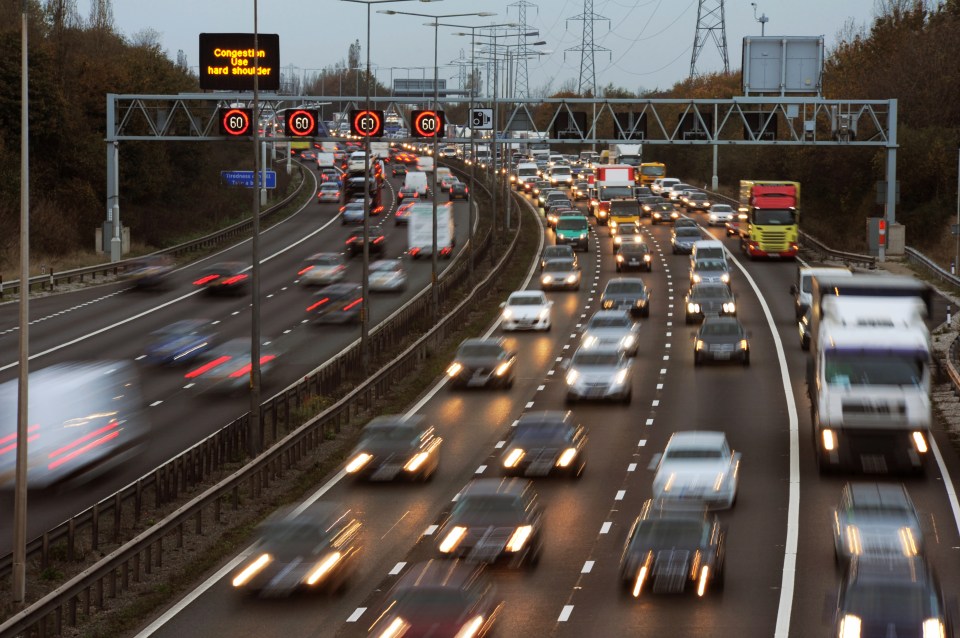 Rush hour traffic on a multi-lane highway.
