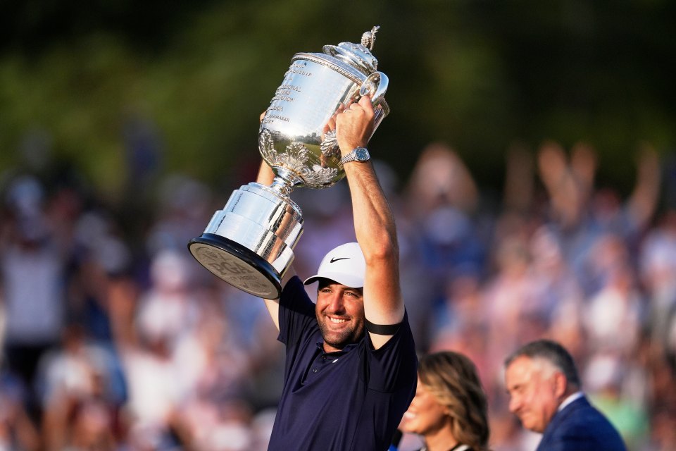 Scottie Scheffler holding the Wanamaker Trophy.