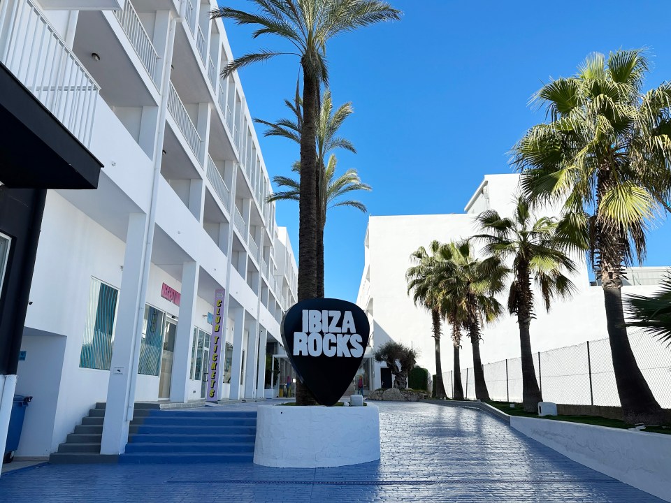 Ibiza Rocks Hotel entrance with palm trees.