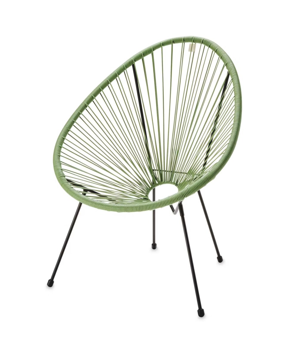 Green sling chair with black legs.