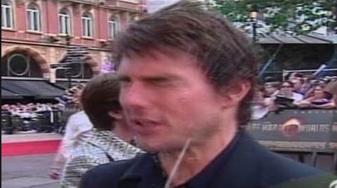 Tom Cruise at the War of the Worlds premiere, getting squirted with water.