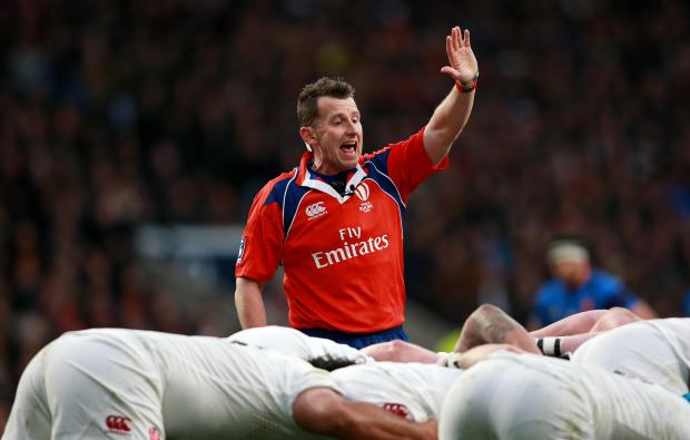 Referee Nigel Owens officiating a rugby match.