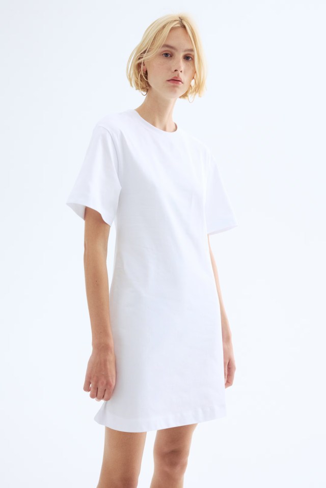 Woman in a white t-shirt dress.