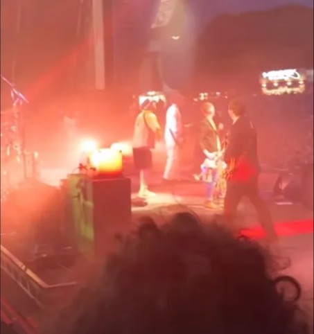 Concert photo showing a band performing on stage.