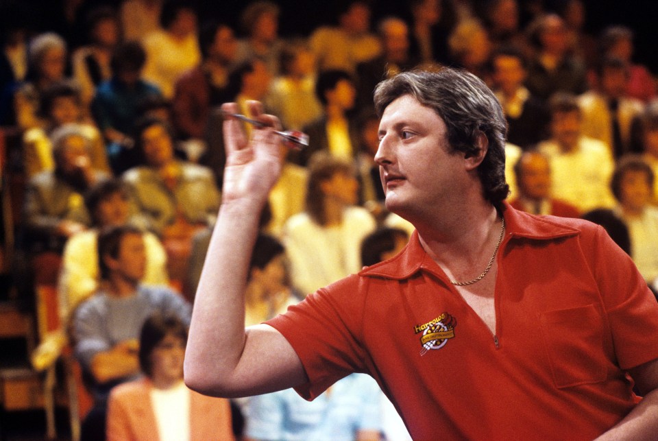 Eric Bristow throwing a dart on the game show Bullseye.