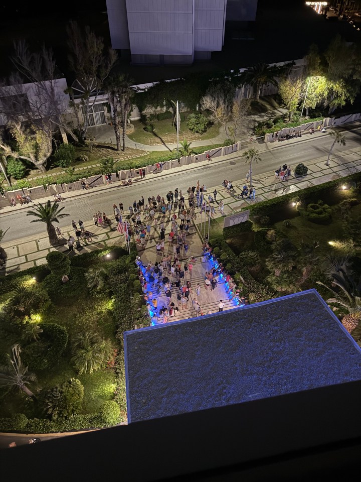 Aerial view of a crowd of people gathered at night.