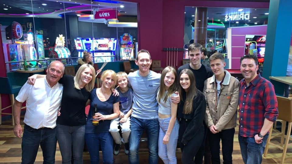 Glenn Colmer pictured with family and friends. Release date June 2 2025. A "fit and healthy" dad was diagnosed with a brain tumour - and died just six days later. Glenn Colmer, 51, suffered a sudden seizure at his home in Southampton on February 18 this year.  He was rushed to hospital where a CT scan revealed a mass on his brain - and just days later, on February 22, he was diagnosed with a high-grade glioma.  The "much-loved" sports teacher, who his devastated wife Ali described as "strong, active, and the healthiest man [she] knew", tragically died on February 28.  Now, Glenn's family are sharing his story to spread awareness of the "indiscriminate" cancer - and raise money for Brain Tumour Research.