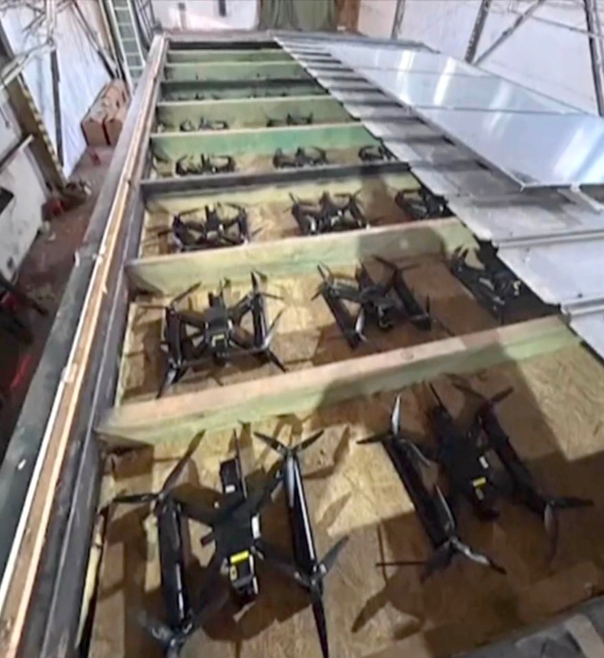 Many drones stored in a warehouse.